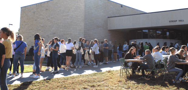 students meeting in front of Stroup Hall, FHSU